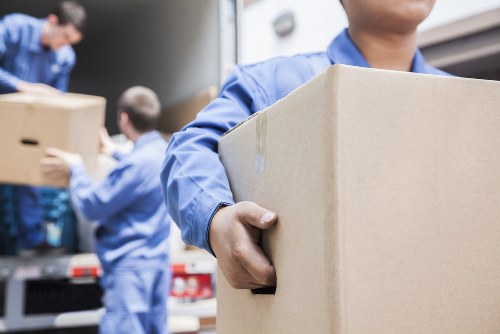Professional small removals service handling boxes in Surbiton
