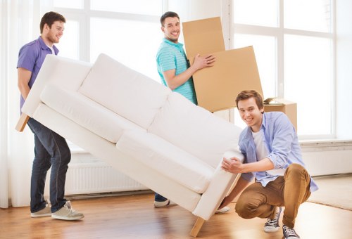Packed moving boxes and furniture prepared for Surbiton removals