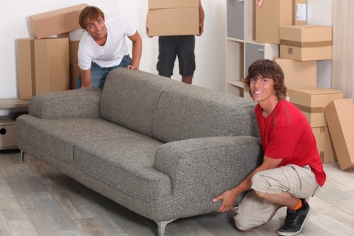 Small removals team helping with a compact flat move
