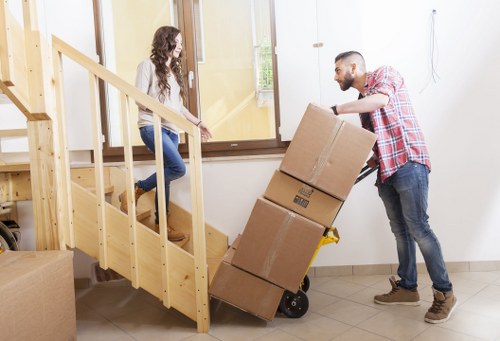 Home removal team carefully loading items in Surbiton